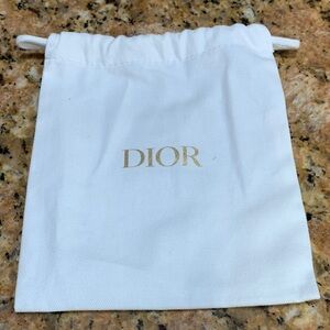 Authentic brand new Dior pouch with strings, must have for collectors/travellers